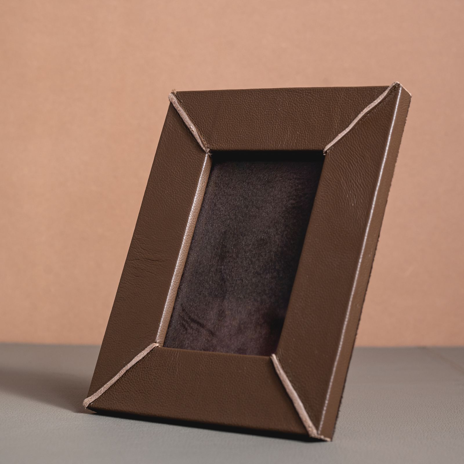 Plain-grain leather homeware styled on a tabletop